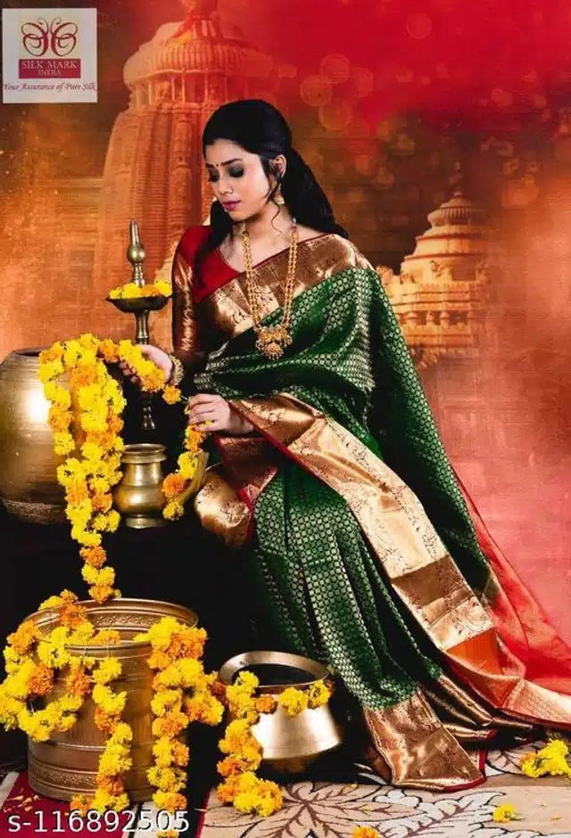 Model wearing green jacquard saree with blouse in rich gold zari border drape for festive occasions