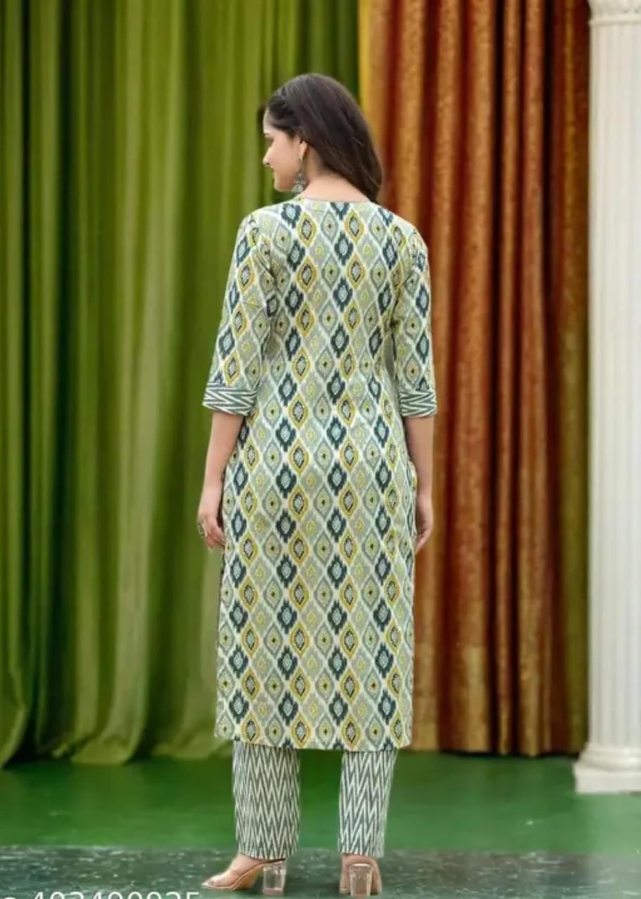 Back view of woman modeling green ikat printed viscose rayon kurta pant dupatta set with matching straight pants