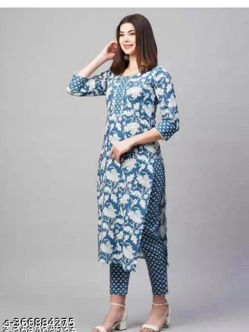 Blue and white floral cotton printed kurti with pant ensemble featuring three quarter sleeves and tapered printed pants