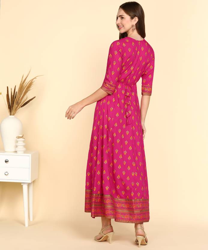 Woman wearing a pink rayon printed kurti for women with three-quarter sleeves and ethnic patterns