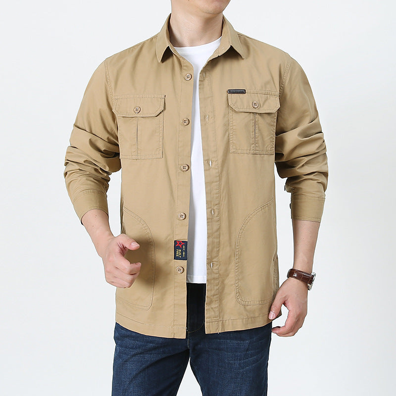 Beige mens lightweight button up shirt with chest pockets long sleeves and casual fit over white tee