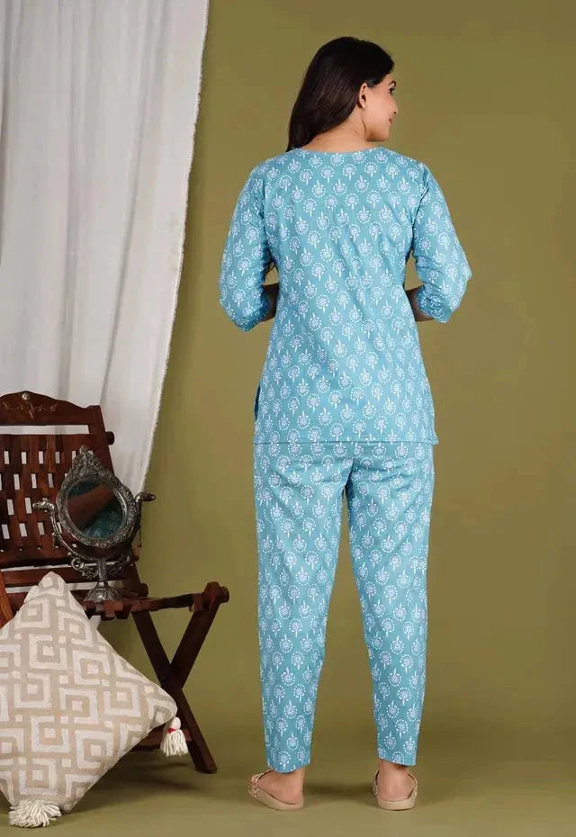Back view of woman wearing blue womens kurtis floral print co ord set with long sleeves and matching pants