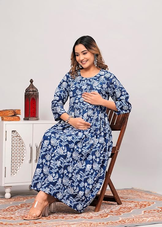 Smiling woman wearing a blue and white floral printed kurti for women sitting on a wooden chair