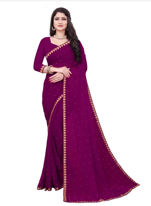 Model wearing deep magenta wedding saree with blouse piece featuring gold border and scattered embellishments