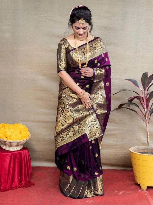 Woman modeling Banarasi silk saree royal blue listing shown in deep purple with gold zari floral motifs and matching blouse