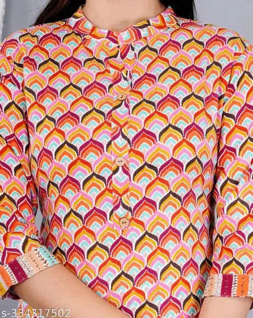 Stylish Indian kurta sets featuring colorful patterned women's kurti with buttoned front and three-quarter sleeves