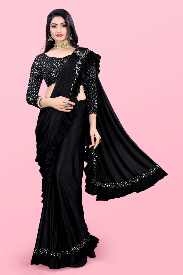 Affordable party wear saree for women in black with sequin work and ruffle border worn by model