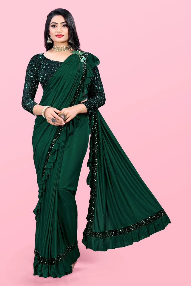 Affordable party wear saree for women in dark green with sequin blouse and ruffled border