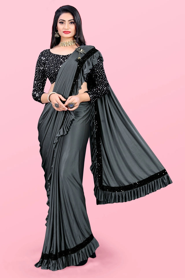 Affordable party wear saree for women in black with ruffled border and sequin blouse