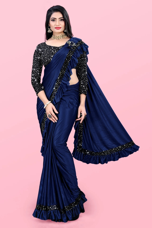 Woman wearing a navy blue affordable party wear saree for women with black embellished blouse