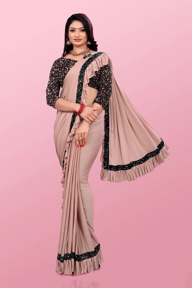 Affordable party wear saree for women in beige with black embellished border and floral blouse