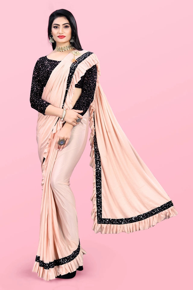 Affordable party wear saree for women in peach with black sequin blouse and border details