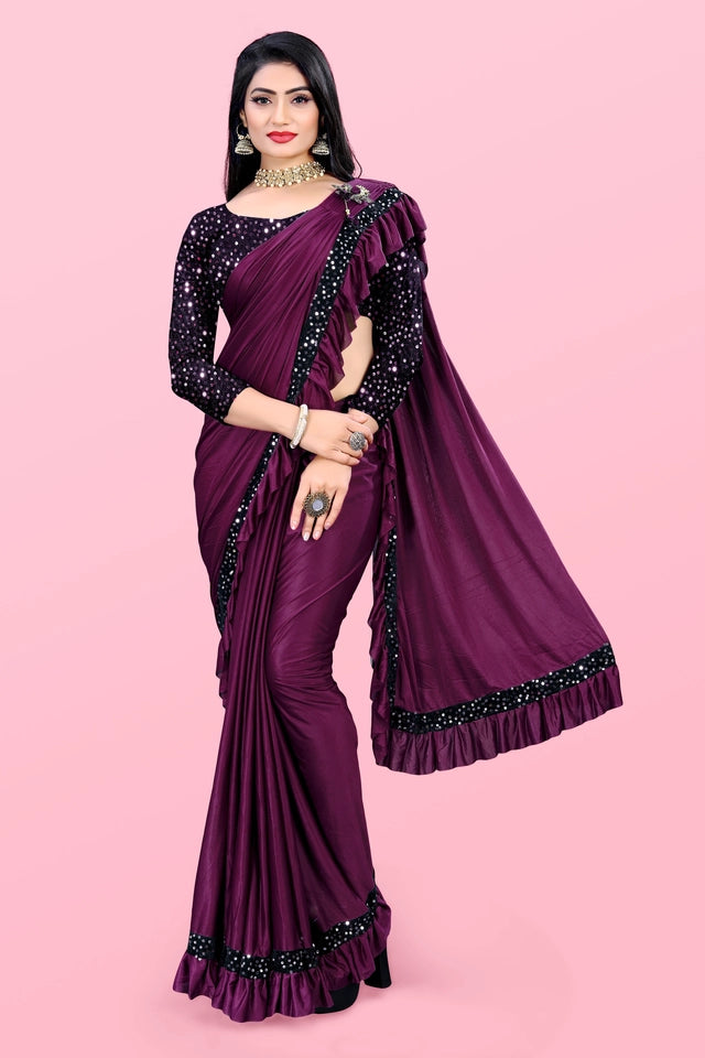 Woman wearing a purple affordable party wear saree for women with black embellished blouse