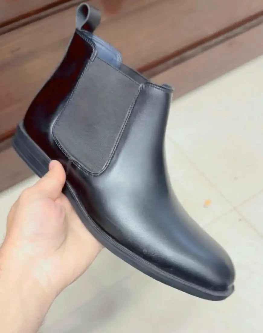Black slip on boots for men with smooth leather and elastic side panels for easy wear