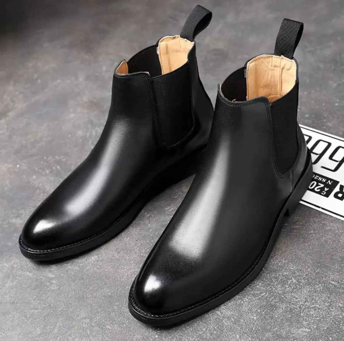 Black slip on boots for men made of smooth leather with elastic sides and pull tabs