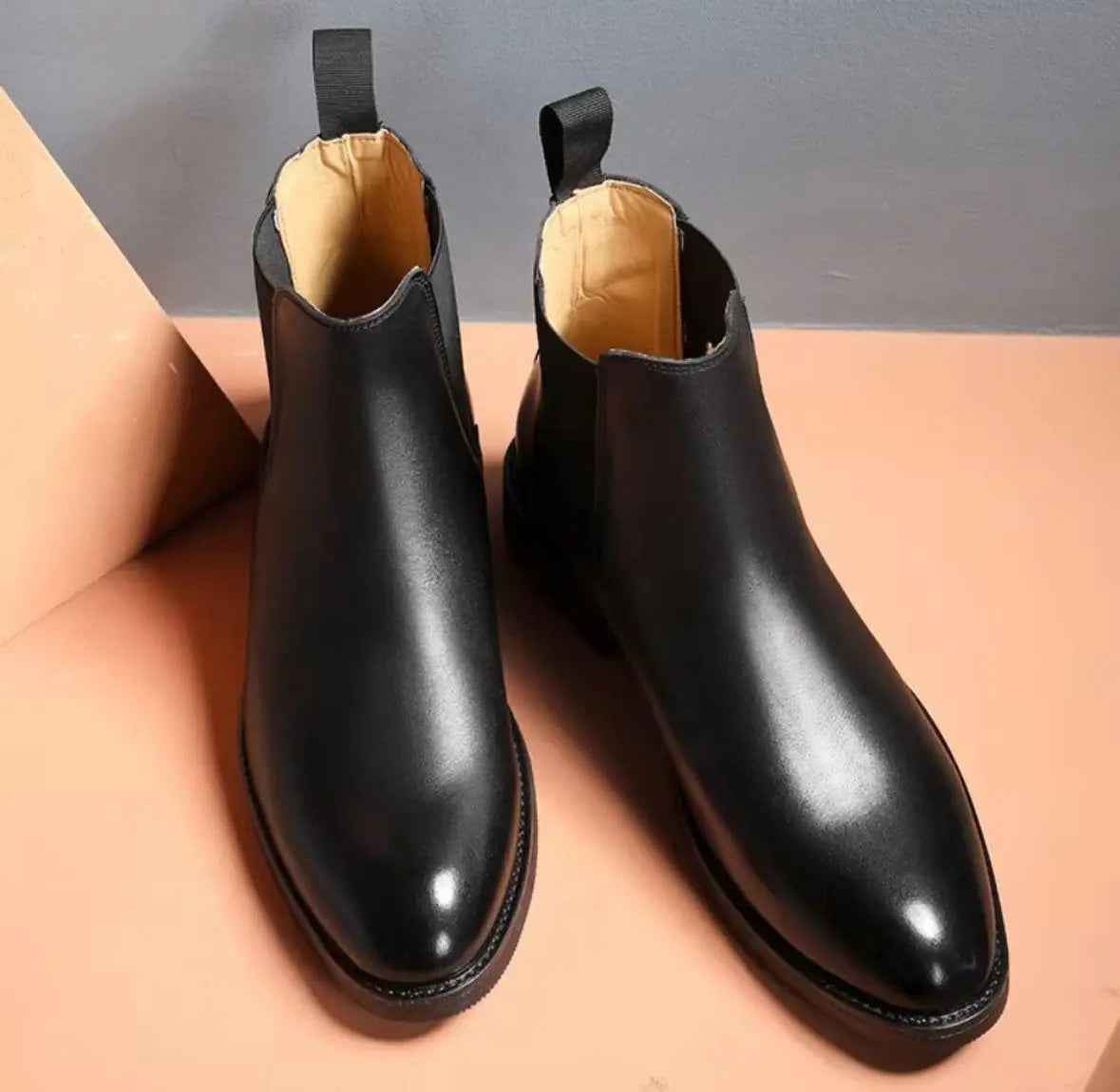 Black slip on boots for men with smooth leather finish and pull tab for easy wear
