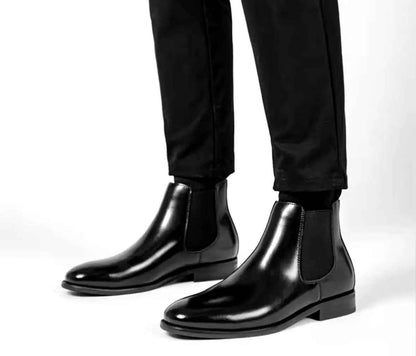 Stylish black slip on boots for men made of smooth leather with elastic side panels for easy wear