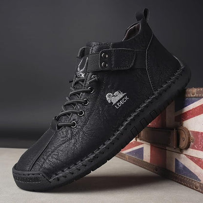 Casual black boots for men with lace-up design and ankle strap on textured sole