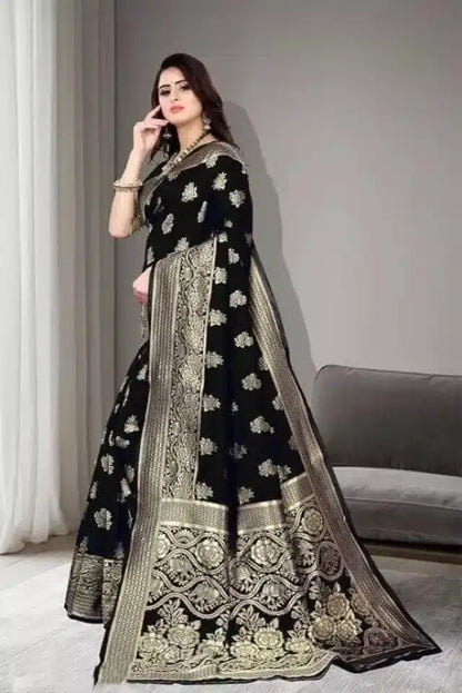 Model wearing black jacquard foil printed saree with ornate gold border and floral motifs draped elegantly