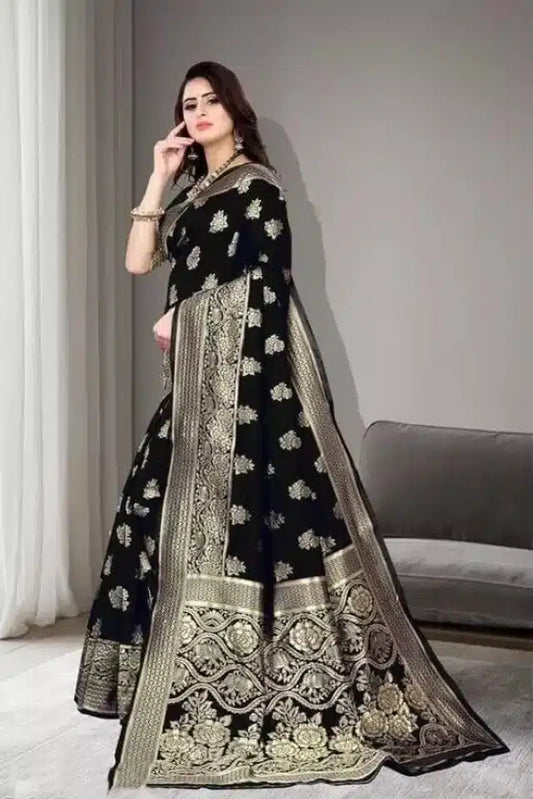 Model wearing black jacquard foil printed saree with ornate gold border and floral motifs draped elegantly