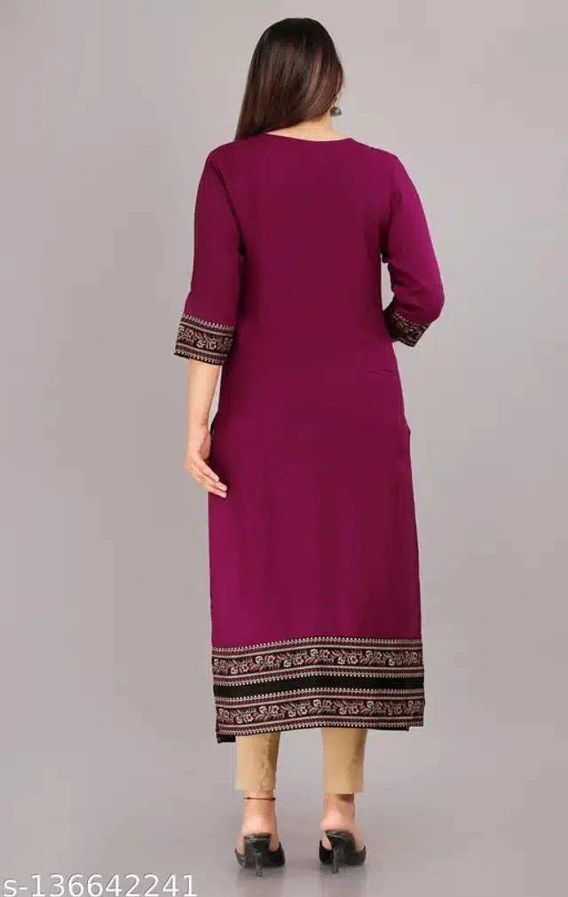 Back view of woman wearing designer rayon kurti for women in purple with embroidered sleeves and hem