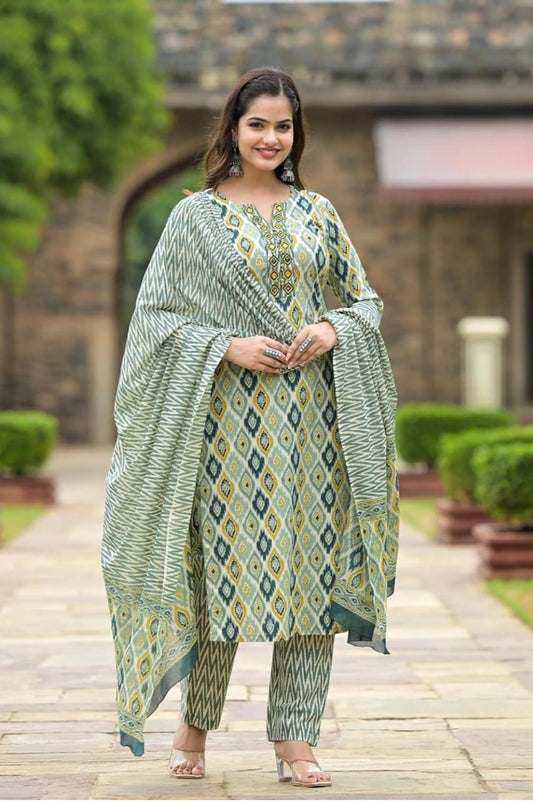 Smiling model in green printed viscose rayon kurta pant dupatta set with straight pants and coordinating dupatta