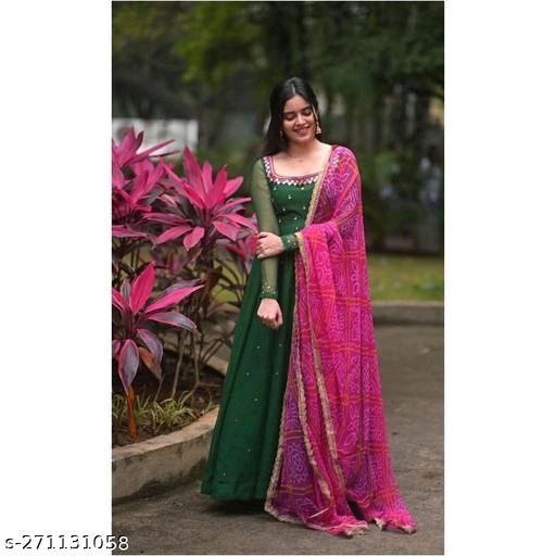 Model wearing emerald green floor length georgette gown kurta with dupatta in pink printed design
