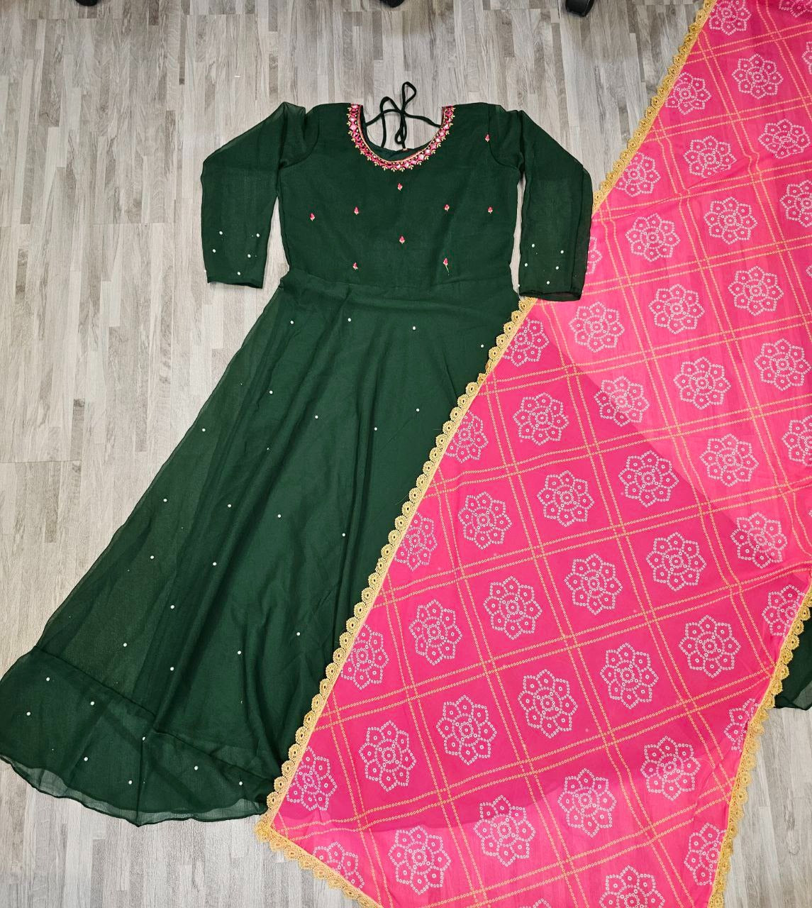 Dark green embroidered long sleeve georgette gown kurta with dupatta paired with pink patterned dupatta with gold trim