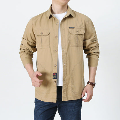Beige mens lightweight button up shirt with chest pockets long sleeves and casual fit over white tee