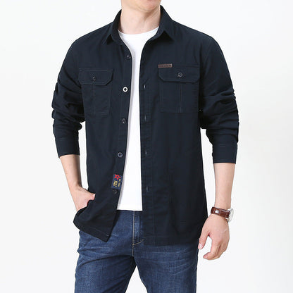 mens lightweight button up shirt navy long sleeve worn open over white tee with chest pockets and jeans