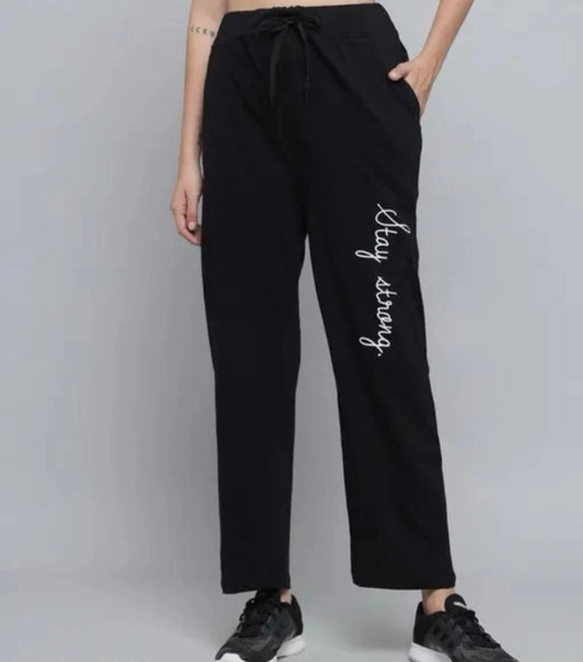 Drawstring black trousers with side pockets and white stay strong script on leg and black casual trousers for women