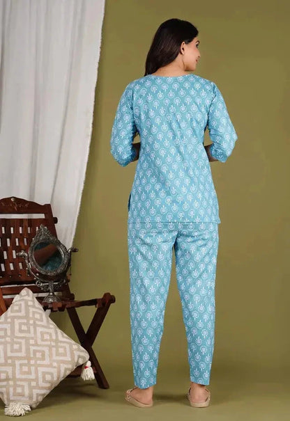 Back view of woman wearing blue womens kurtis floral print co ord set with long sleeves and matching pants