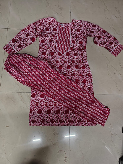 Red and white printed floral cotton kurta set for women flat lay with long kurta and matching straight pants