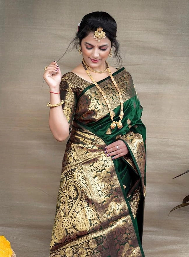 Model wearing Banarasi silk saree royal blue listing product appears emerald green with intricate gold brocade work