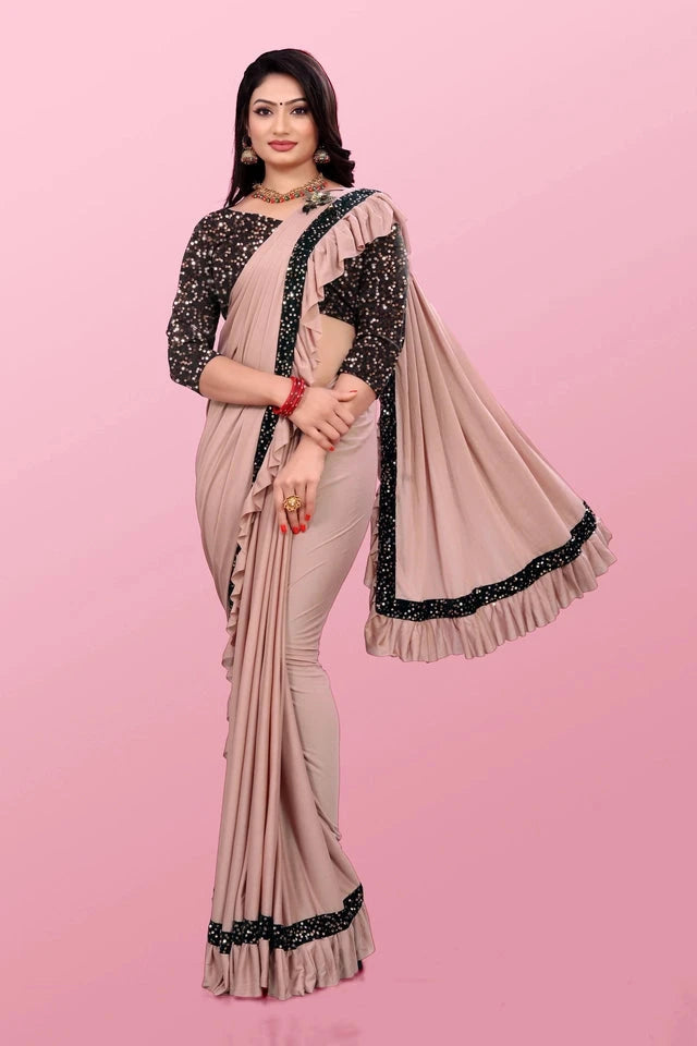 Affordable party wear saree for women in beige with black lace border and ruffle details